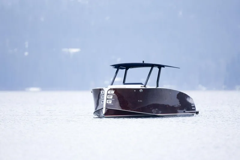 Slide: The Image of 2023 StanCraft 340 Hammerhead Center Console boat on calm water. - 5