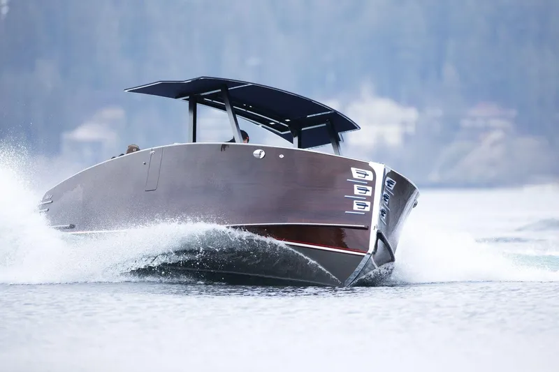 Slide: The Image of 2023 StanCraft 340 Hammerhead Center Console cruising on water, showcasing sleek design. - 8