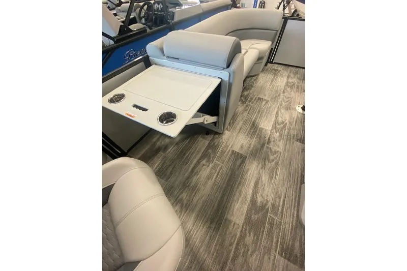 Slide: The Image of 2026 Bentley Pontoons Legacy 223 Swingback interior with seating and fold-out table. - 16