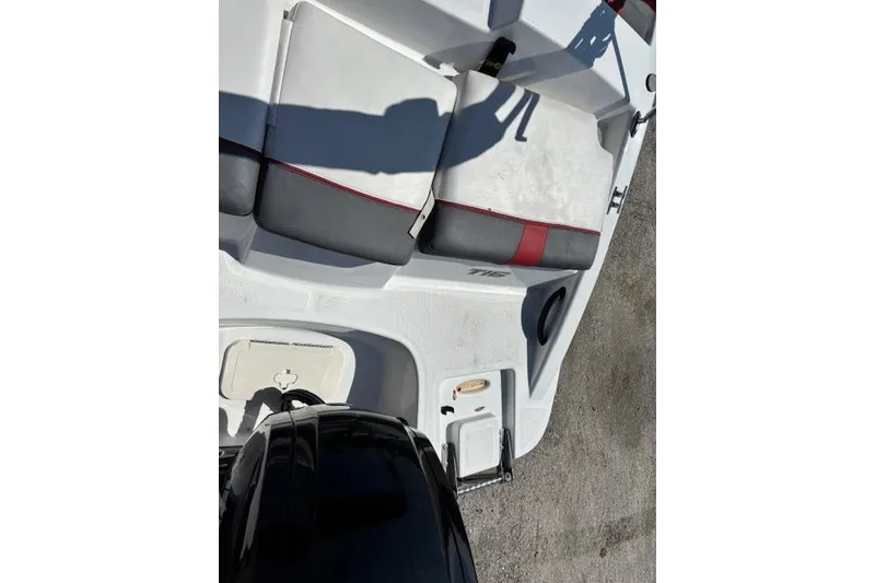 Slide: The Image of 2020 Tahoe T16 boat interior with seating and motor, featuring red and gray accents. - 67