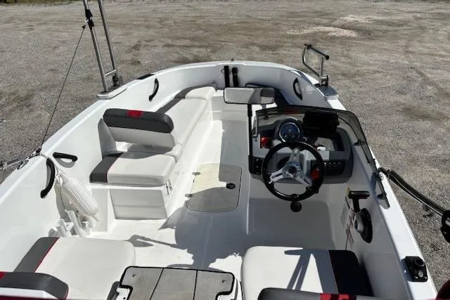 Slide: The Image of 2020 Tahoe T16 boat interior with steering wheel, seating, and control panel. - 69
