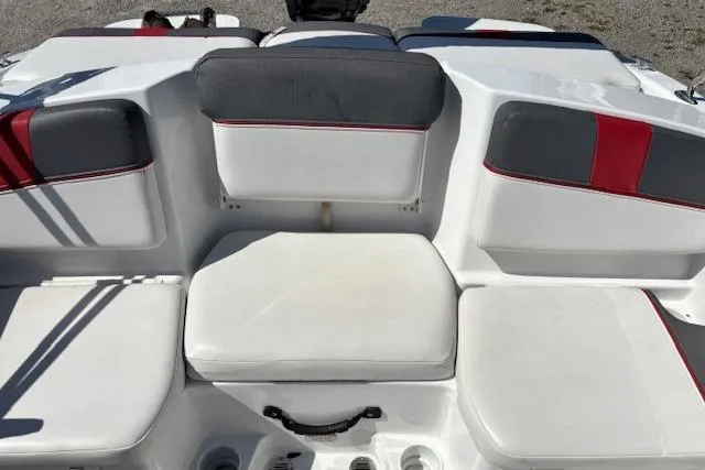 Slide: The Image of 2020 Tahoe T16 boat interior with white and gray seating, red accents. - 76