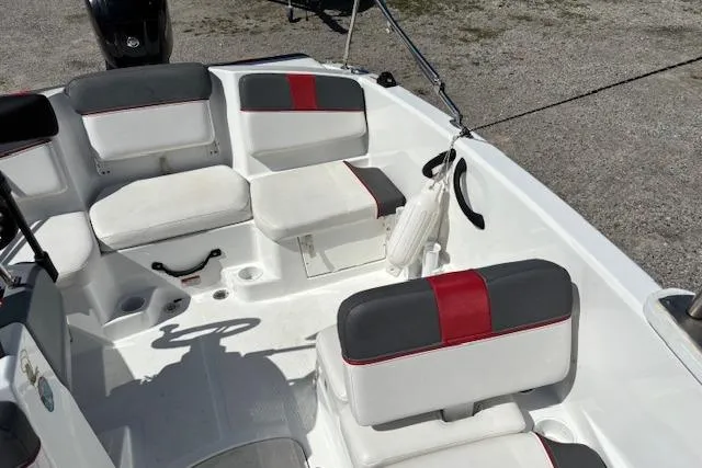 Slide: The Image of 2020 Tahoe T16 boat interior with white and red seating, clean and spacious layout. - 79
