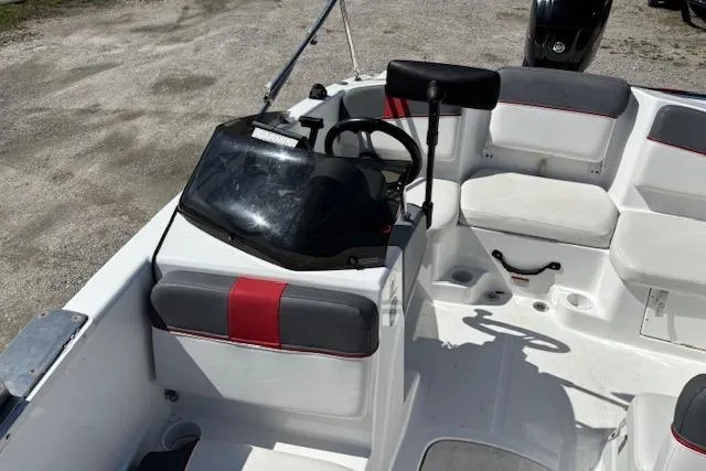 Slide: The Image of 2020 Tahoe T16 boat interior with steering wheel and seating arrangement. - 80