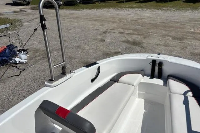 Slide: The Image of 2020 Tahoe T16 boat interior with white seating and metal railing. - 83