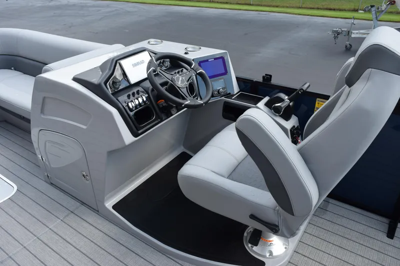 Slide: The Image of 2026 Bentley Pontoons Elite 253 Swingback helm with modern controls and seating. - 11