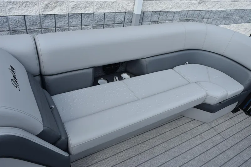 Slide: The Image of Luxurious seating on 2026 Bentley Pontoons Elite 253 Swingback, featuring sleek gray upholstery. - 15