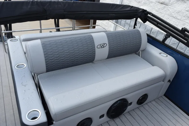 Slide: The Image of 2026 Bentley Pontoons Elite 253 Swingback with luxurious seating and integrated speakers. - 8