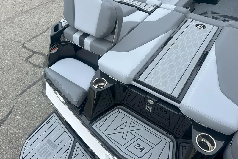 Slide: The Image of 2025 MasterCraft XT24 boat interior with sleek seating and modern design elements. - 10