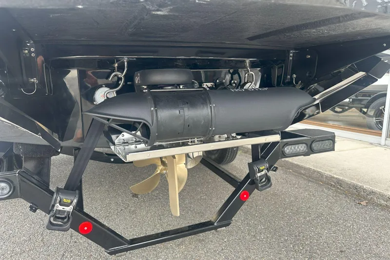 Slide: The Image of 2025 MasterCraft XT24 boat propeller and rudder system, close-up view. - 11