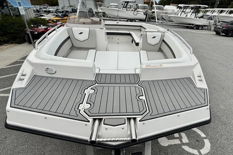 Slide: The Image of 2026 Starcraft SVX 191 OB boat with sleek deck design and spacious seating. - 4