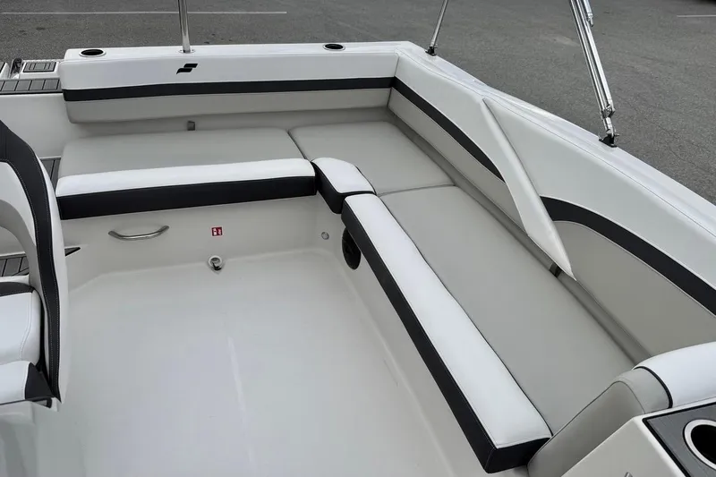 Slide: The Image of 2026 Starcraft SVX 191 OB boat interior with white and black seating. - 5