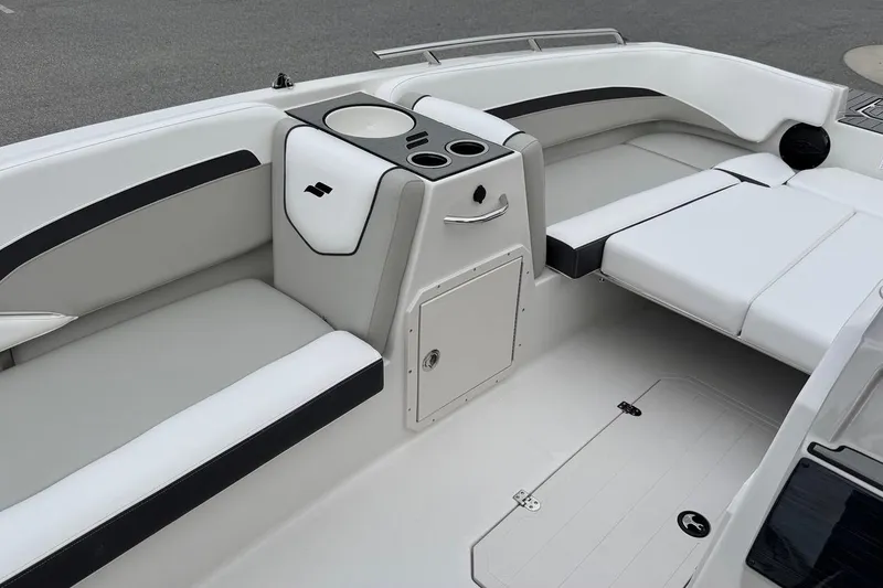 Slide: The Image of 2026 Starcraft SVX 191 OB boat interior with sleek seating and storage compartments. - 6
