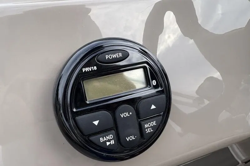 Slide: The Image of Close-up of a 2021 Sun Tracker Party Barge 20 DLX audio control panel. - 17