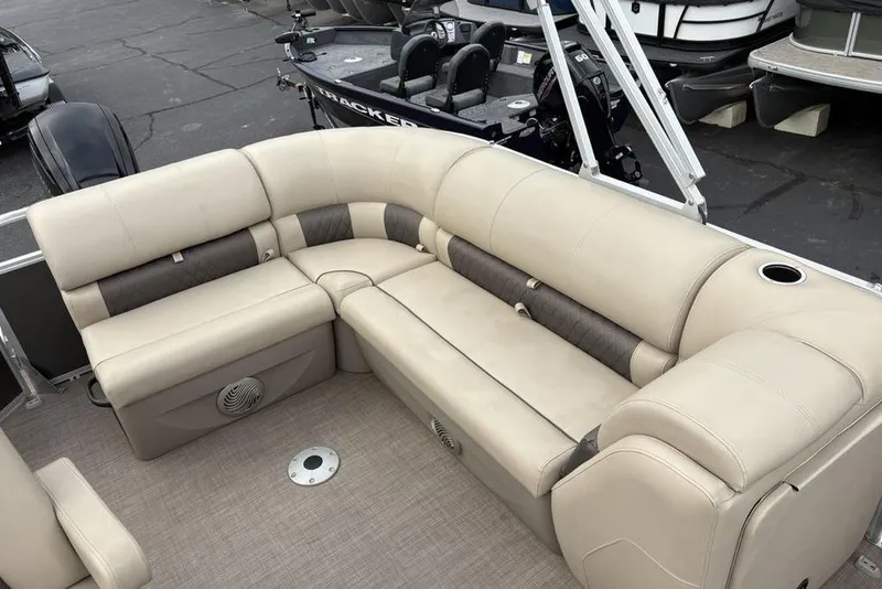 Slide: The Image of 2021 Sun Tracker Party Barge 20 DLX with beige seating and spacious layout. - 19