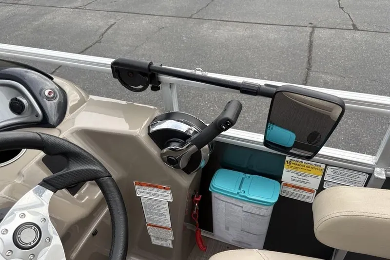 Slide: The Image of 2021 Sun Tracker Party Barge 20 DLX helm with steering wheel and controls. - 21