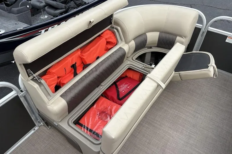 Slide: The Image of 2021 Sun Tracker Party Barge 20 DLX with storage compartments and life jackets. - 3