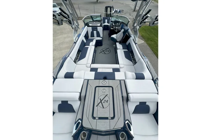 Slide: The Image of 2021 MasterCraft X24 boat interior with luxurious seating and modern design. - 14