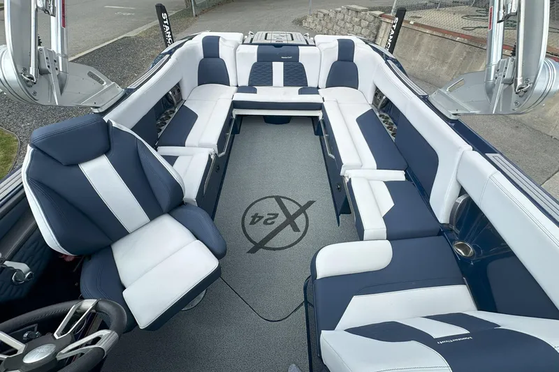 Slide: The Image of Interior of 2021 MasterCraft X24 boat with luxurious blue and white seating. - 3