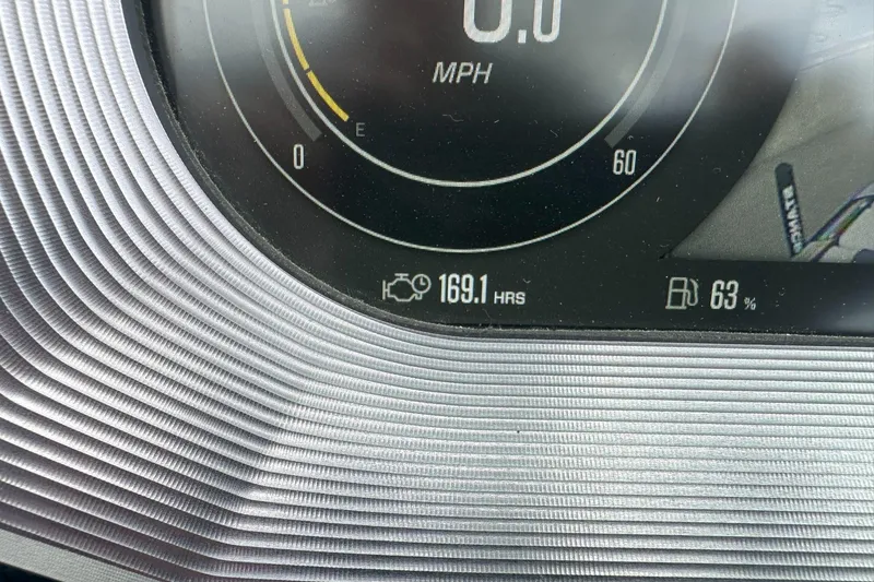 Slide: The Image of Close-up of 2021 MasterCraft X24 dashboard showing 169.1 hours and 63% fuel. - 8