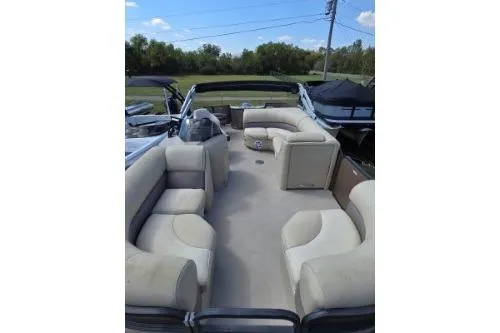 Slide: The Image of 2015 Manitou 20 Oasis Angler pontoon boat with spacious seating and open deck. - 14