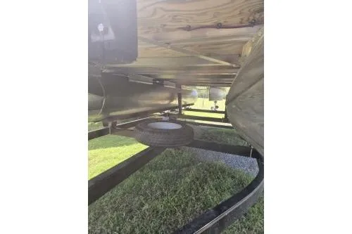 Slide: The Image of Underneath view of 2015 Manitou 20 Oasis Angler pontoon boat on trailer. - 3