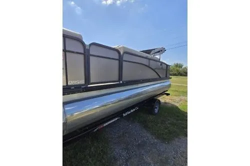 Slide: The Image of 2015 Manitou 20 Oasis Angler pontoon boat on trailer, side view. - 4