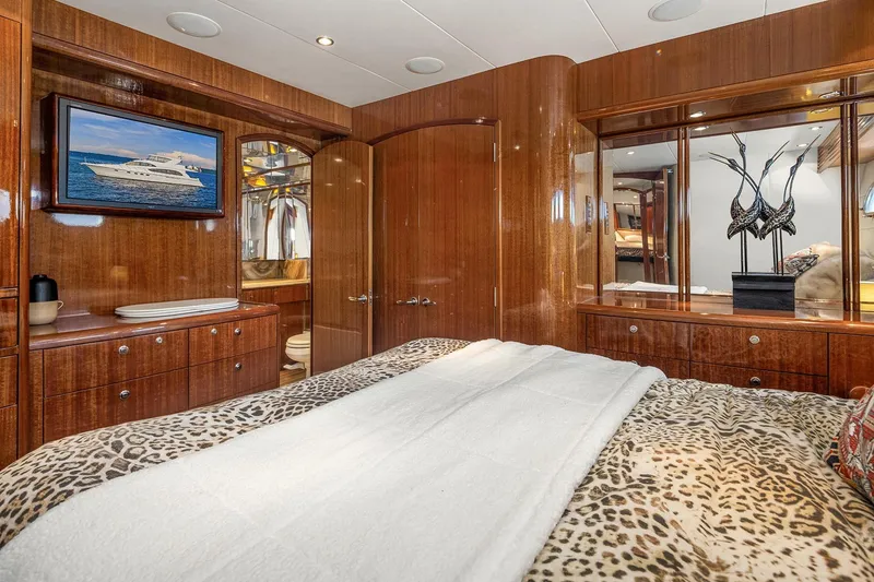Slide: The Image of Luxurious bathroom in 2001 Hatteras 63 Cockpit Motor Yacht with elegant wood and marble finishes. - 13