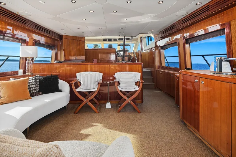 Slide: The Image of Luxurious interior of 2001 Hatteras 63 Cockpit Motor Yacht with elegant seating and ocean view. - 2