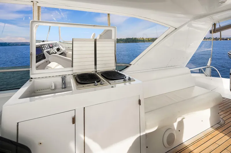Slide: The Image of Helm of 2001 Hatteras 63 Cockpit Motor Yacht with ocean view and modern controls. - 20