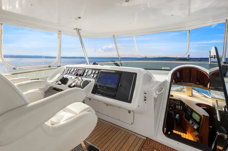 Slide: The Image of Luxurious 2001 Hatteras 63 Cockpit Motor Yacht with elegant interior and ocean view. - 21