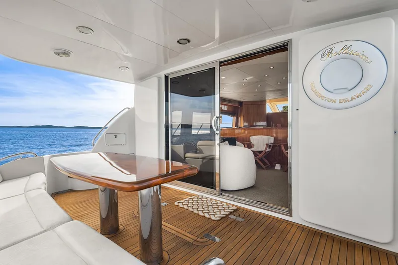 Slide: The Image of Spacious deck of 2001 Hatteras 63 Cockpit Motor Yacht with ocean view. - 22