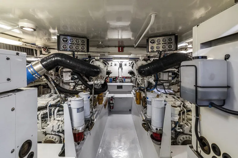 Slide: The Image of Engine room of 2001 Hatteras 63 Cockpit Motor Yacht with dual Caterpillar engines. - 25