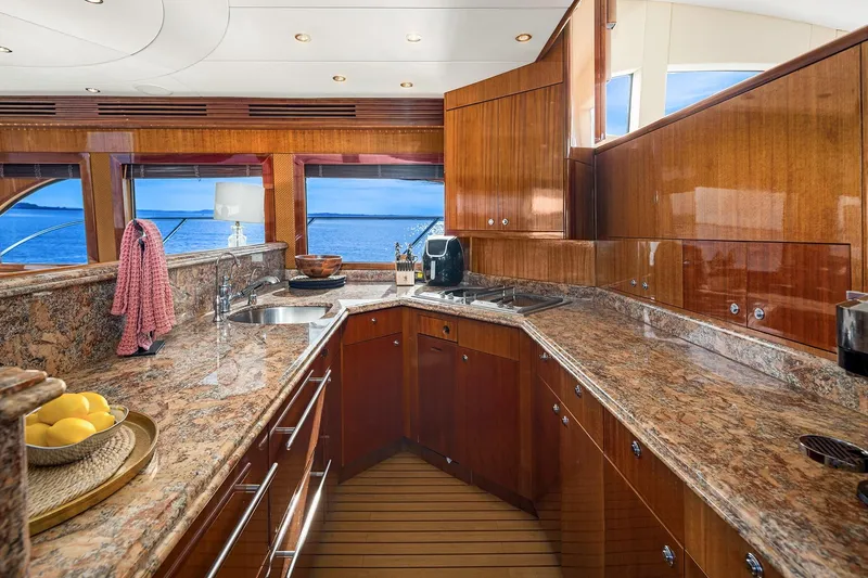 Slide: The Image of Luxurious interior of 2001 Hatteras 63 Cockpit Motor Yacht with panoramic ocean views. - 6