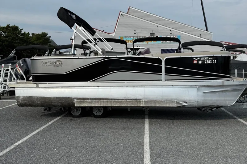 The Image of 2017 SunCatcher V22GT pontoon boat parked in a lot, side view. - 1