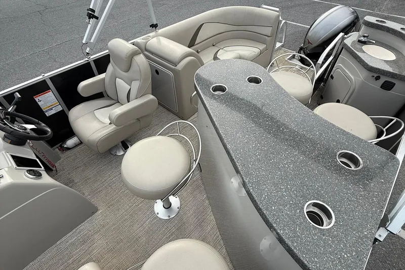 Slide: The Image of Luxurious 2017 SunCatcher V22GT pontoon boat interior with plush seating and modern amenities. - 10