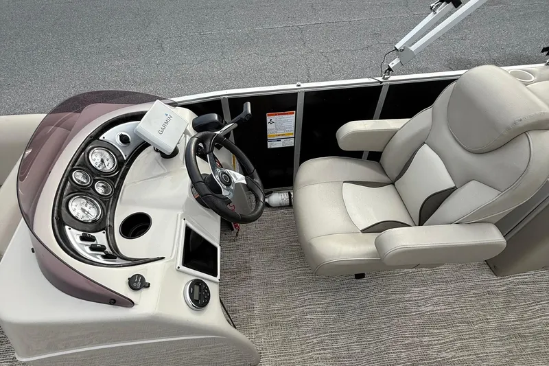 Slide: The Image of Captain's seat and control panel of 2017 SunCatcher V22GT boat with Garmin navigation. - 12