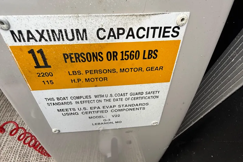 Slide: The Image of Boat capacity label for SunCatcher V22GT, 2017, showing maximum 11 persons or 1560 lbs. - 15