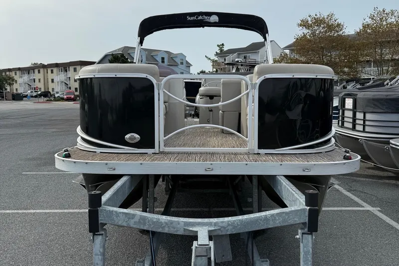 Slide: The Image of 2017 SunCatcher V22GT pontoon boat on trailer in parking lot. - 3