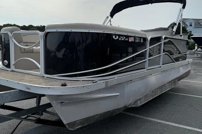 Slide: The Image of 2017 SunCatcher V22GT pontoon boat on trailer in parking lot. - 4
