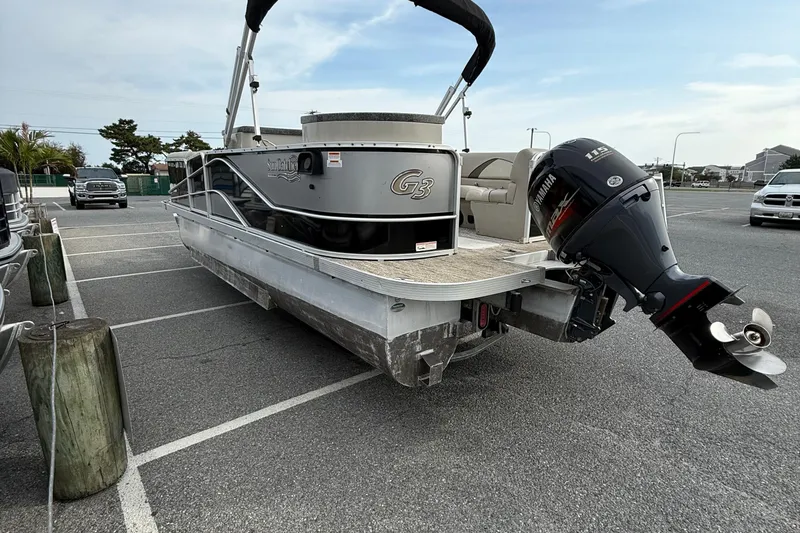 Slide: The Image of 2017 SunCatcher V22GT pontoon boat with Yamaha outboard motor in a parking lot. - 6