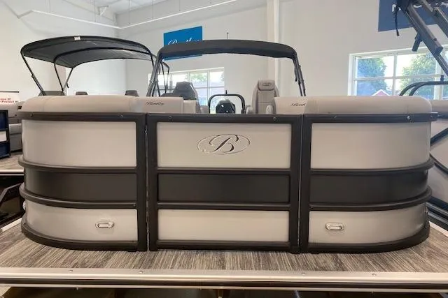 Slide: The Image of 2026 Bentley Pontoons Legacy 243 Navigator, luxury pontoon boat in showroom setting. - 4