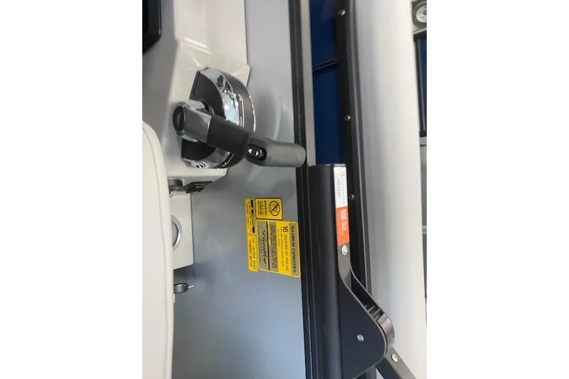 Slide: The Image of Control panel of 2026 Bentley Pontoons Legacy 243 Navigator with safety labels. - 8