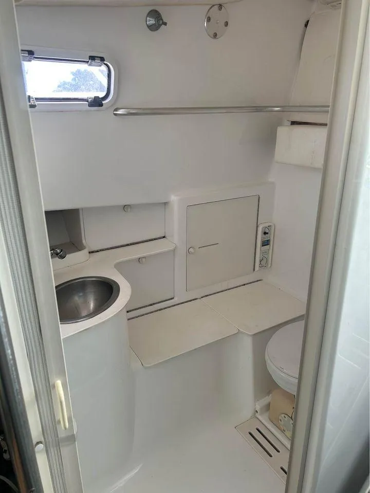 Slide: The Image of 1982 Robertson 3500 Custom Sportfish boat bathroom with sink, toilet, and storage. - 13