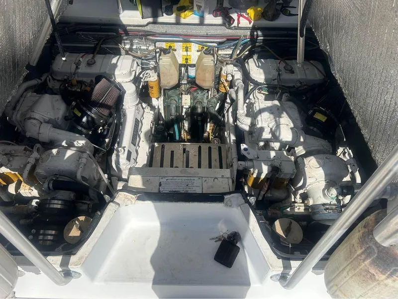 Slide: The Image of Engine compartment of a 1982 Robertson 3500 Custom Sportfish boat, showcasing dual engines. - 15