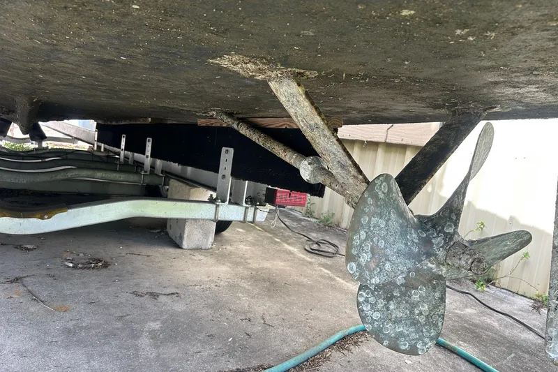 Slide: The Image of Underneath view of a 1982 Robertson 3500 Custom Sportfish boat on a trailer. - 18