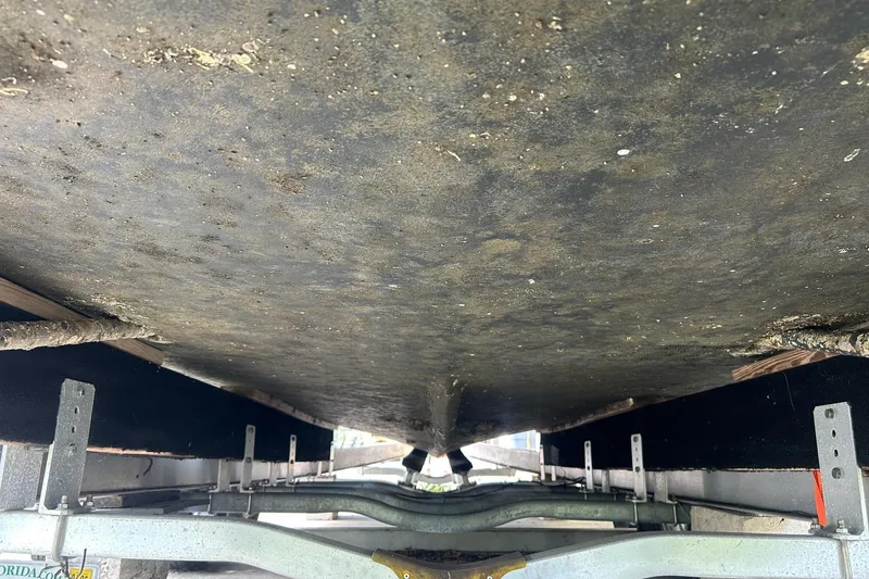 Slide: The Image of Underside view of 1982 Robertson 3500 Custom Sportfish boat on trailer. - 21