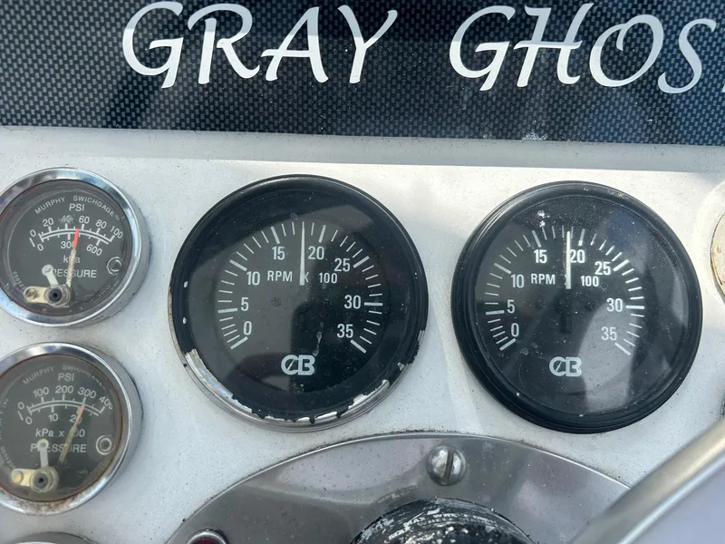 Slide: The Image of Instrument panel of 1982 Robertson 3500 Custom Sportfish boat, featuring gauges and "Gray Ghost" label. - 8