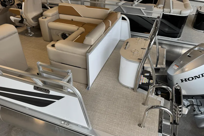 Slide: The Image of 2026 Avalon Venture 85 ELW pontoon boat interior with Honda motor and seating. - 12