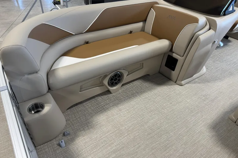 Slide: The Image of Luxurious seating in 2026 Avalon Venture 85 ELW boat, featuring cup holder and speaker. - 5